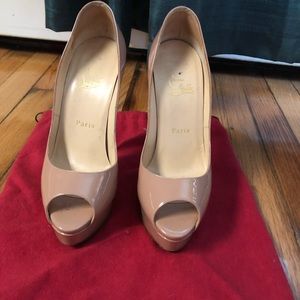Christian Louboutin peep toe platform heels. Nude